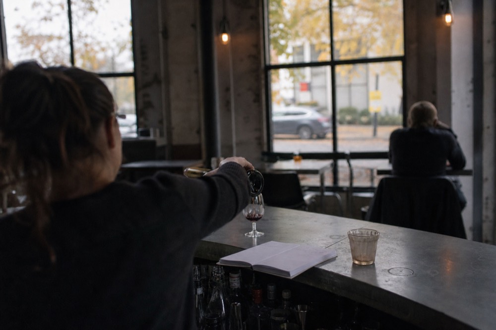 Sommelier pouring wine at a tasting room, no text, no logos, no people