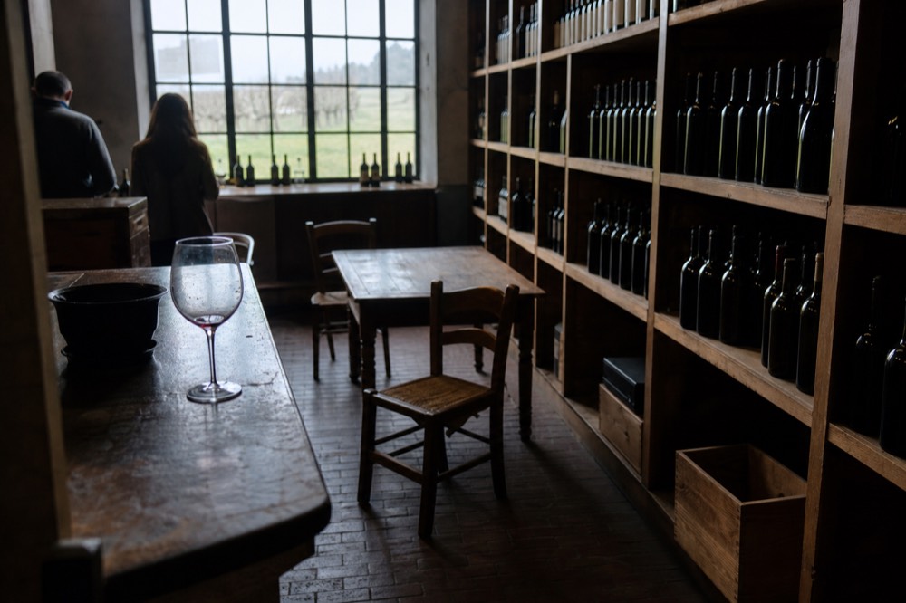Interior of a tasting room on Sonoma Plaza with wine glasses and bottles, no text, no logos, no people