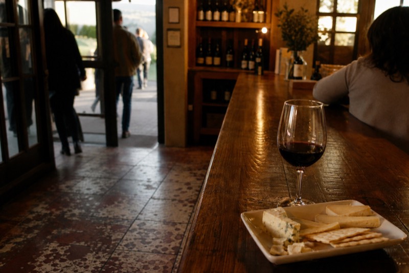 Wine and cheese tasting room counter in a Healdsburg tasting room in late afternoon