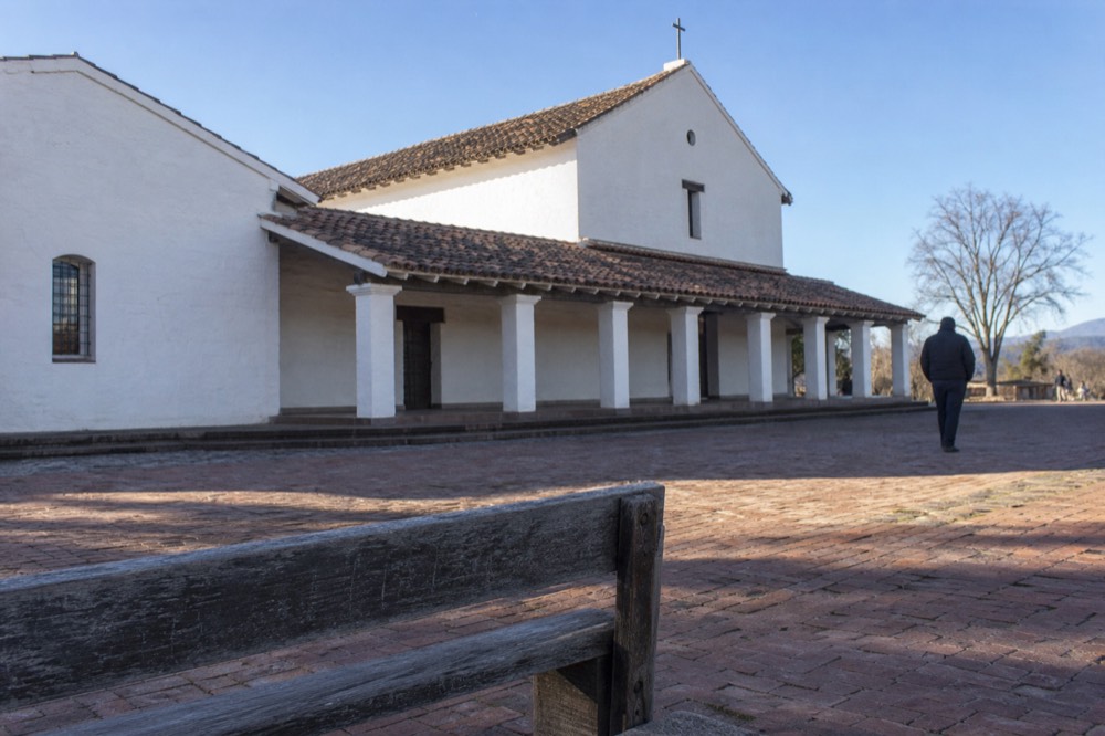 Facade of Mission San Francisco Solano with white walls and clay tile roof, no text, no logos, no people