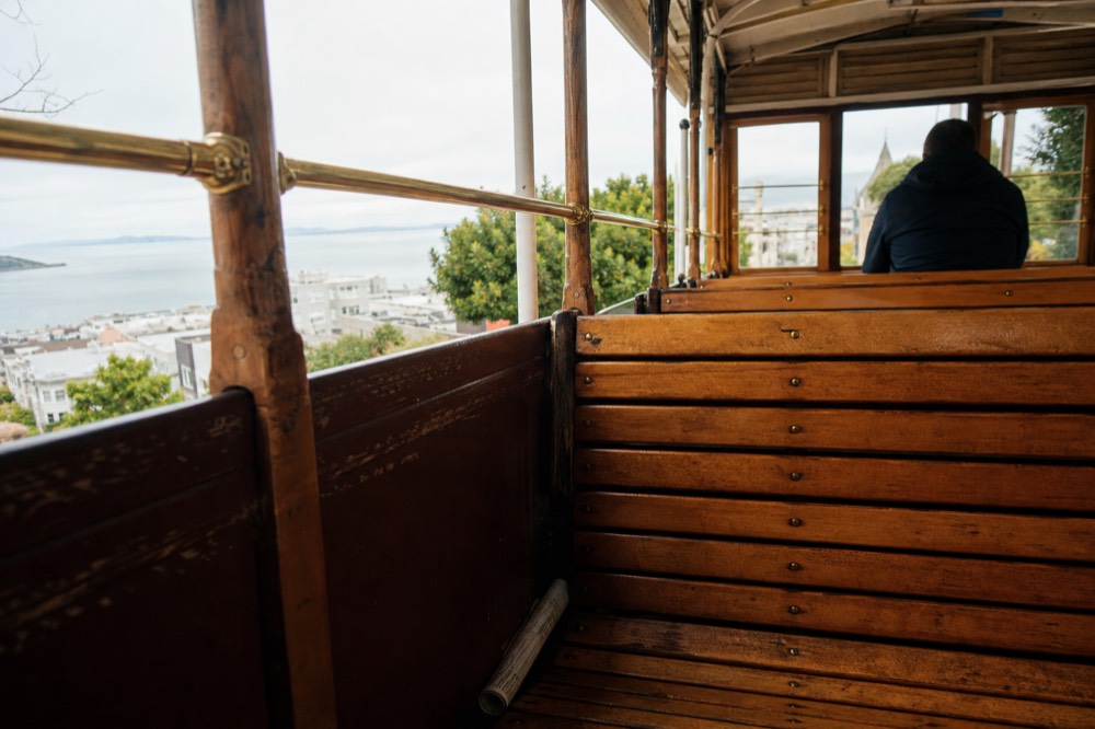 Wine trolley replica cable car interior with bench seats, no text, no logos, no people