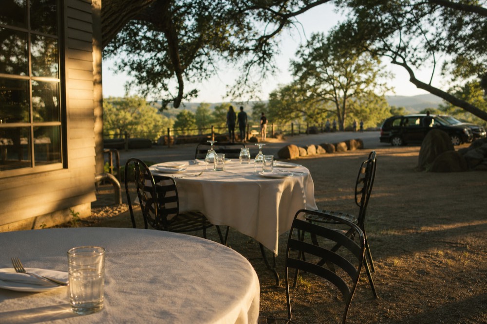 Outdoor tables set for lunch beside a Sonoma tasting room, no text, no logos, no people