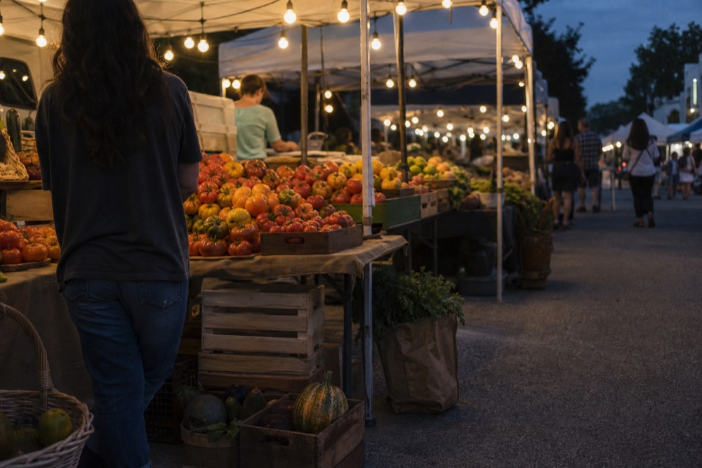 Farmers market stalls with produce, no text, no logos, no people